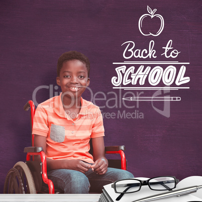Composite image of full length portrait of happy boy on wheelcha