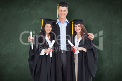 Composite image of full length of three friends graduate from co