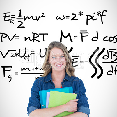 Composite image of smiling student holding notebook and file