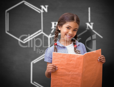 Composite image of cute pupil smiling at camera during class pre