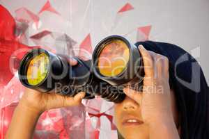 Composite image of cute little girl looking through binoculars