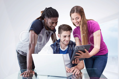 Composite image of creative team looking at digital tablet