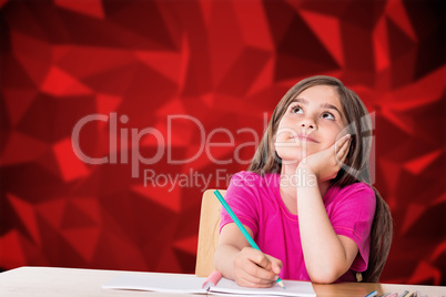 Composite image of cute pupil working at her desk