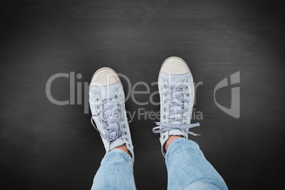 Composite image of woman wearing trainers