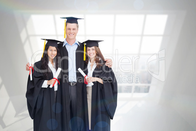 Composite image of full length of three friends graduate from co