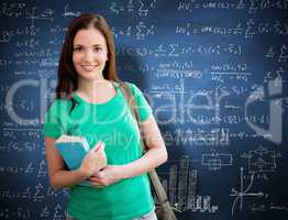 Composite image of student smiling at camera in library