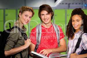 Composite image of college students reading book in library