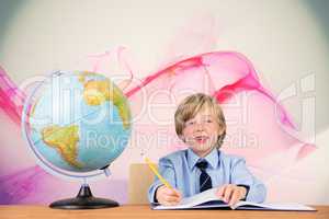 Composite image of cute pupil writing