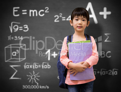 Composite image of cute pupil looking at camera holding notepad