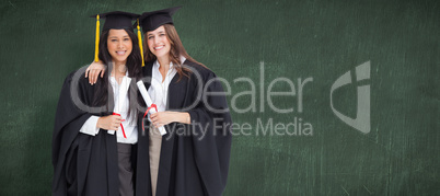 Composite image of two women embracing each other after they gra