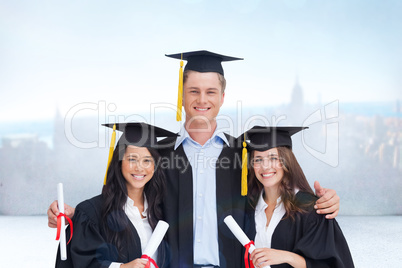 Composite image of three friends graduate from college together