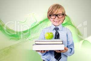 Composite image of cute pupil holding books and apple