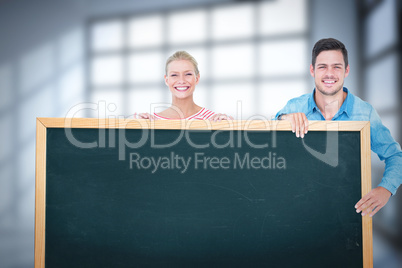 Couple showing chalkboard