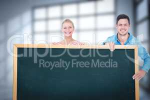 Couple showing chalkboard