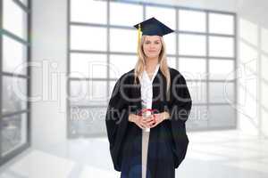 Composite image of blonde student in graduate robe