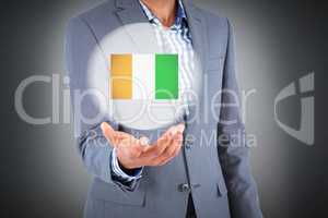 Composite image of businessman holding hand out