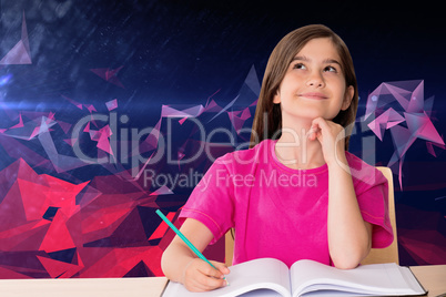 Composite image of cute pupil working at her desk