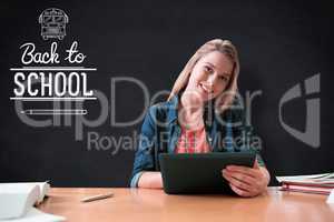 Composite image of student studying in the library with tablet