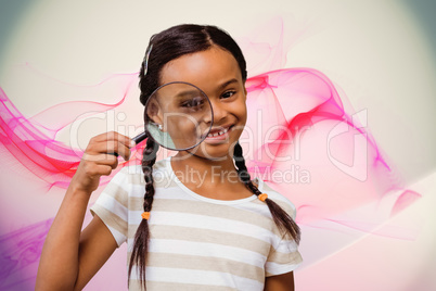 Composite image of happy pupil with magnifying glass