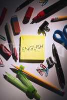 English against students table with school supplies