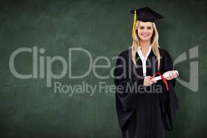 Composite image of smiling blonde student in graduate robe holdi