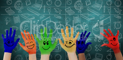 Composite image of hands with colourful smiley faces Composite image of hands with colourful smiley faces