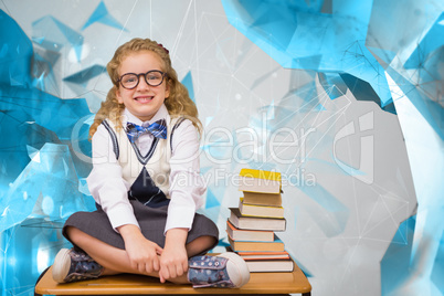 Composite image of cute pupil sitting on table