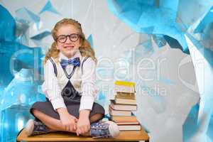 Composite image of cute pupil sitting on table