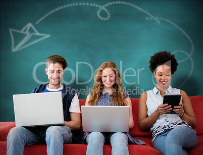 Composite image of creative team using laptops and digital table