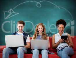 Composite image of creative team using laptops and digital table