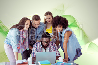 Composite image of fashion students working as a team