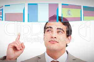 Composite image of close up of salesman looking and pointing up