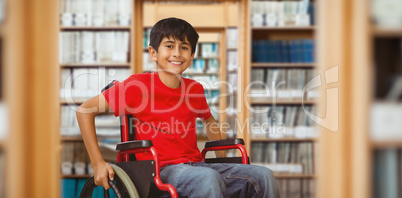 Composite image of portrait of boy sitting in wheelchair