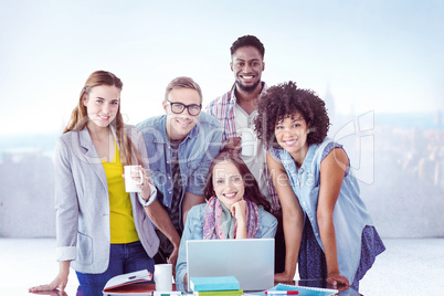 Composite image of fashion students working as a team