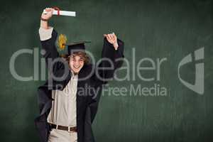 Composite image of male student in graduate robe jumping