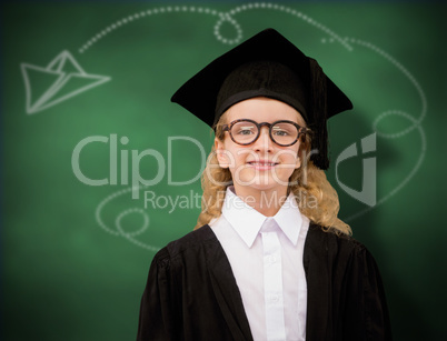 Composite image of cute pupil in graduation robe