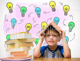 Composite image of cute boy with book on head