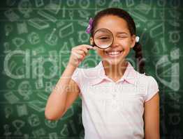 Composite image of little girl with magnifying glass