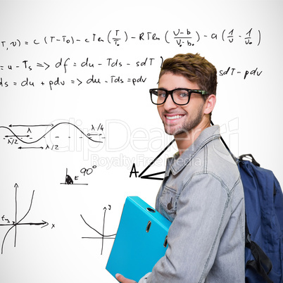 Composite image of student smiling at camera in library