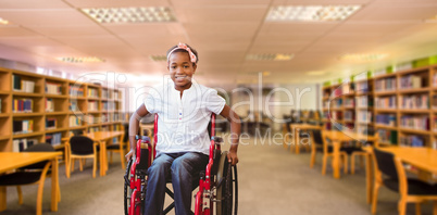 Composite image of girl sitting in wheelchair in school corridor