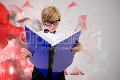 Composite image of cute pupil reading