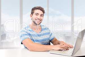 Composite image of student on laptop