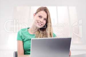 Composite image of student on laptop