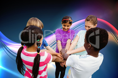 Composite image of children holding hands together at park