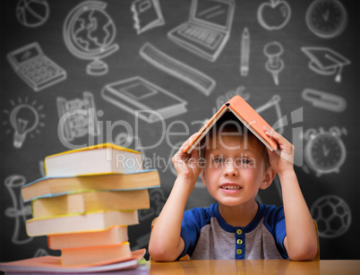 Composite image of cute boy with book on head