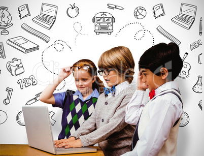 Composite image of pupils using laptop