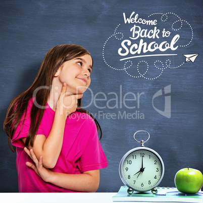 Composite image of cute little girl thinking and looking up