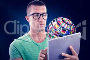 Composite image of man wearing glasses while using tablet comput