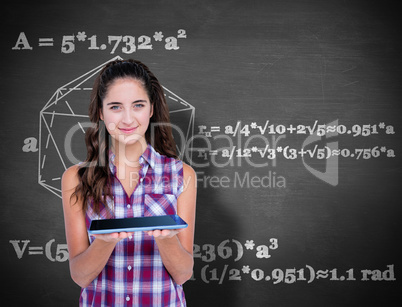 Composite image of happy pretty brunette showing tablet computer