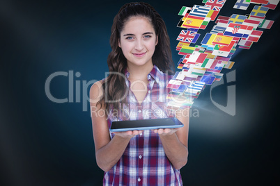 Composite image of happy pretty brunette showing tablet computer